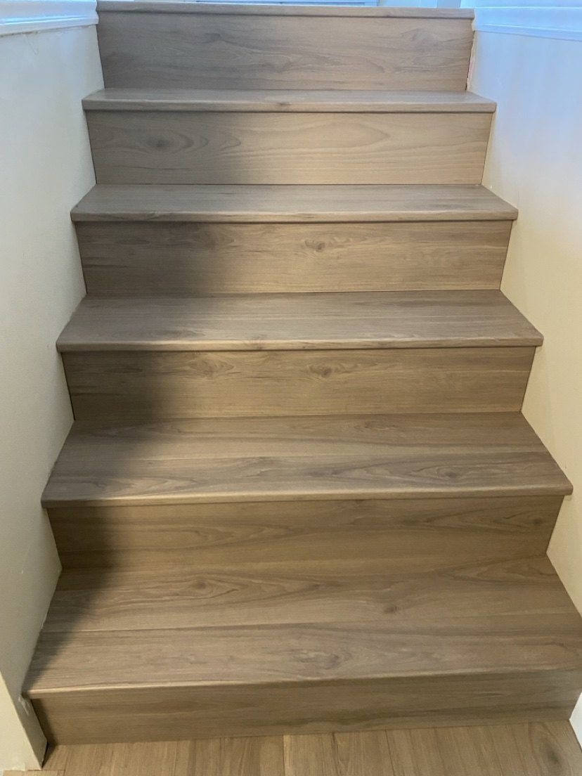 Close-up of a finished wood staircase with tight seams